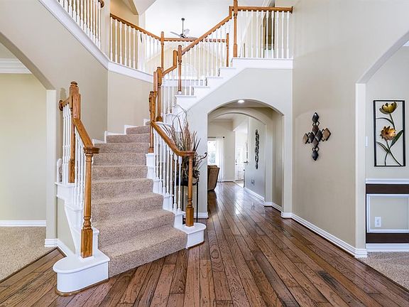 A sunny two-story entry with winding staircase welcomes you when you enter! Wood floors stretch through the entry and into the family room. A dining room and study or living room flank either side of the entry for tons of flexible space!
