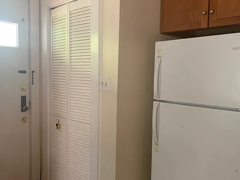 laundry in the closet and view of the door to the private back porch.