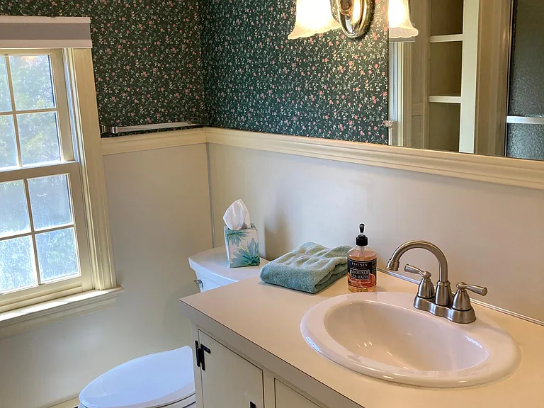 Upstairs bathroom has a new toilet, sink and faucet