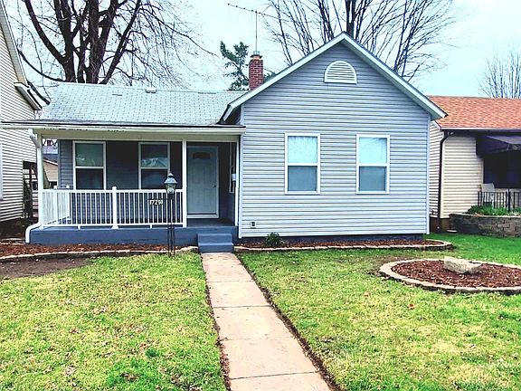 Nice covered concrete patio, new siding, and windows