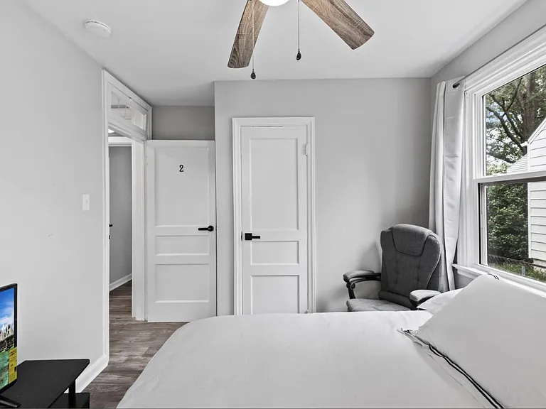 12" pillowtop mattress, blackout curtains, lighted ceiling fan, full body mirror, a massage chair with footstool.