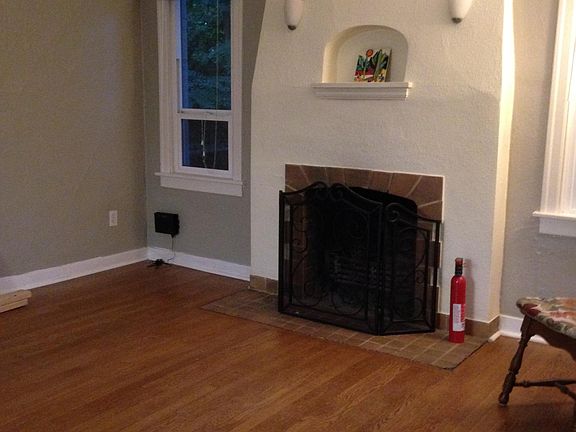 hardwood floors. Quaint decorative fireplace