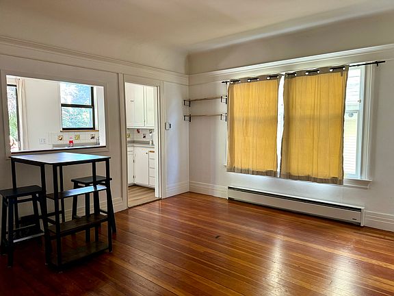 View of the living room (and partial kitchen) from near the front door