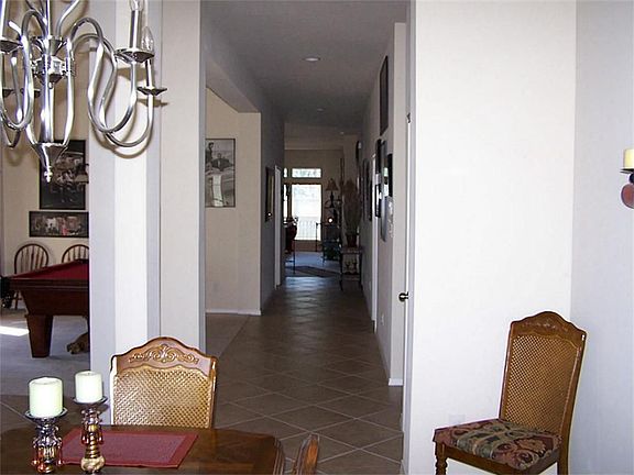 As you enter foyer, to your right is the  living room and to your left is the dining room. Hall leads to den and kitchen.