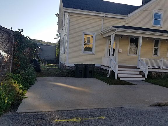 Off street parking. There is no through traffic on Jay Street, but there is a building supply warehouse next door at the end of the street.