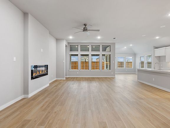 Living room in the Gilmour home plan by Trophy Signature Homes - REPRESENTATIVE PHOTO