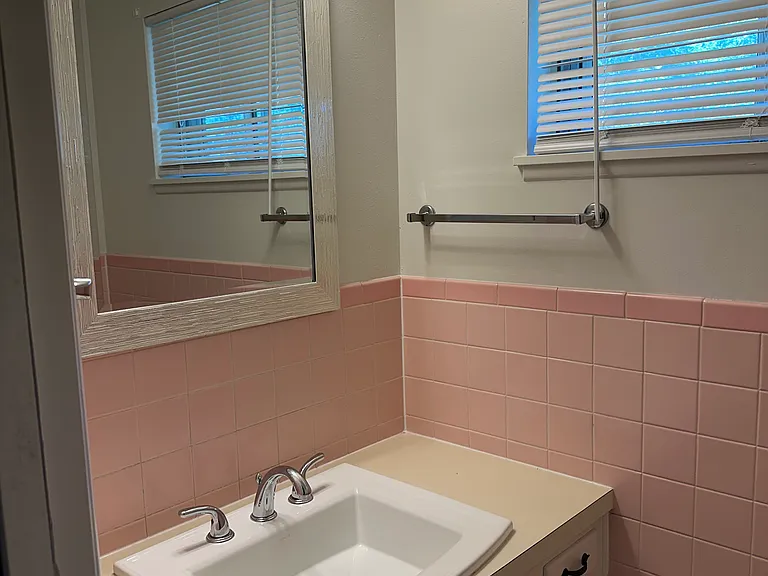 Hall bathroom located off the kitchen.