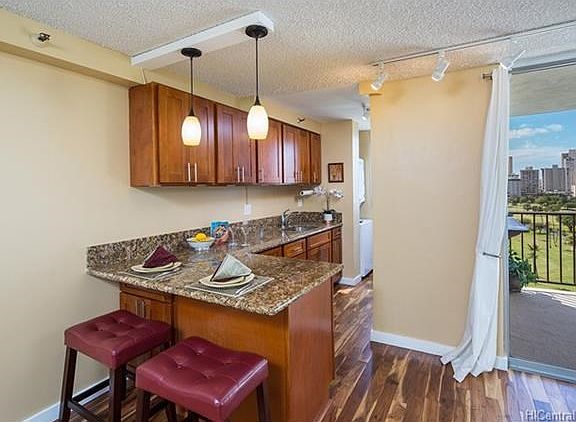 Enjoy meals at this convenient counter bar.  There are many options for dining in this condo.