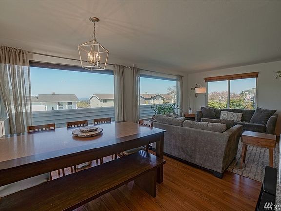 Open floor plan with wall to wall windows to soak in the view and sunshine!!! Gotta love the sunshine!