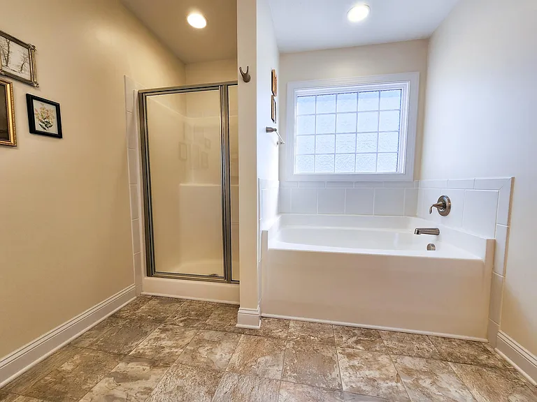 Elegant master bath with separate tub and shower