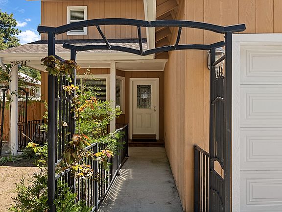 Entry to home with adorable front porch.