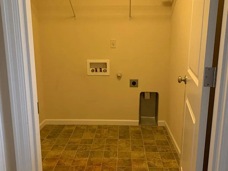 Upstairs laundry room with washer/dryer hookups.