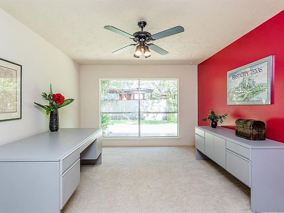 This study is large and could also be used as a great gameroom, playroom or media room. You decide how it would best be used by your family. The wall of windows offer lovely views of the pretty backyard.