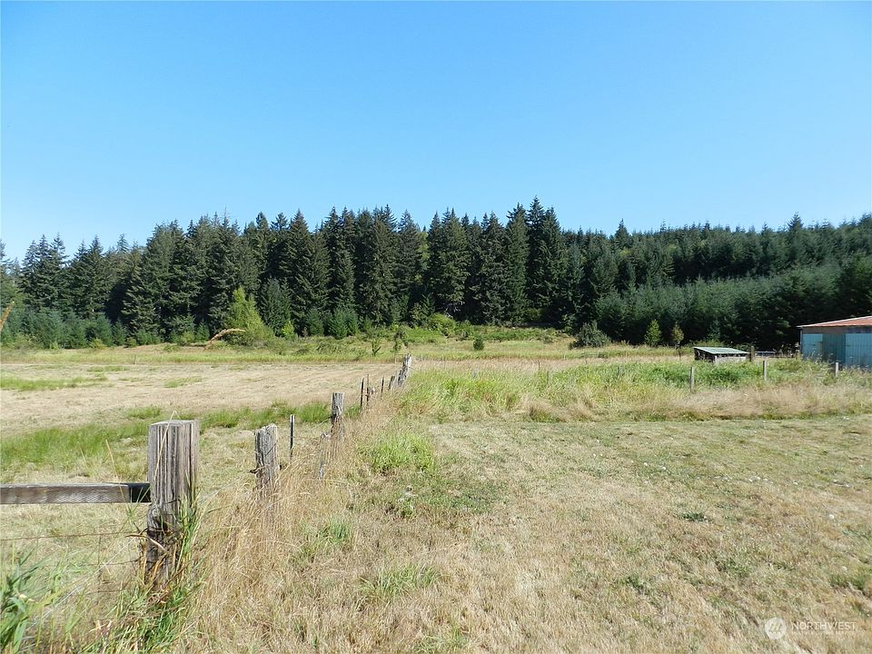 Acreage on left of fence and 30' easement to right, straight ahead is acreage with pasture & timber.>