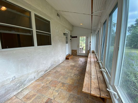 Sunroom with marble floors for plants or storage