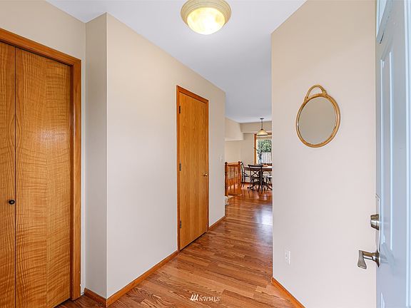 Entryway with coat closet and guest half bath