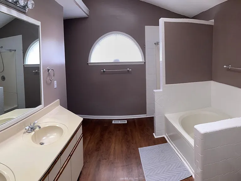 Master bathroom; garden tub and shower on right, toilet around corner to left.