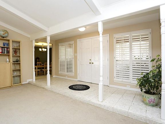 Step inside to an open living area with cathedral beamed ceiling.