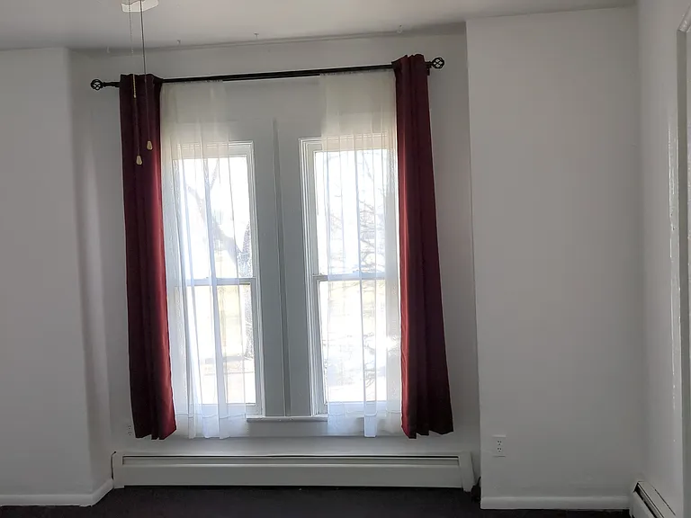 Living room. Window looks out at Curtis Park