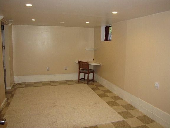 Refinished basement room with walk in closet