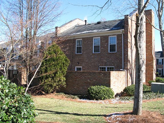 Back of the townhouse with private brick patio.