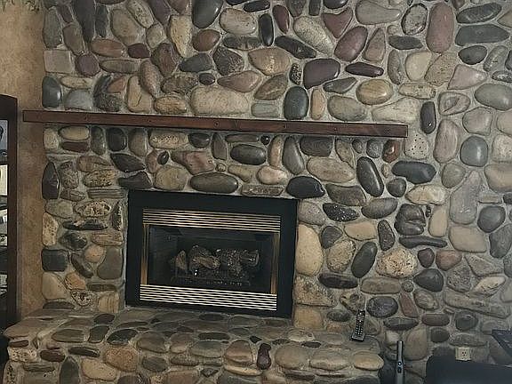 Custom river rock fireplace