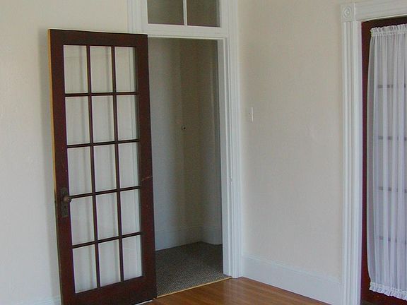 Front room with doors to hall and bedroom.