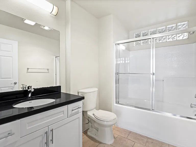 Bathroom with Bathtub and Cabinet Storage