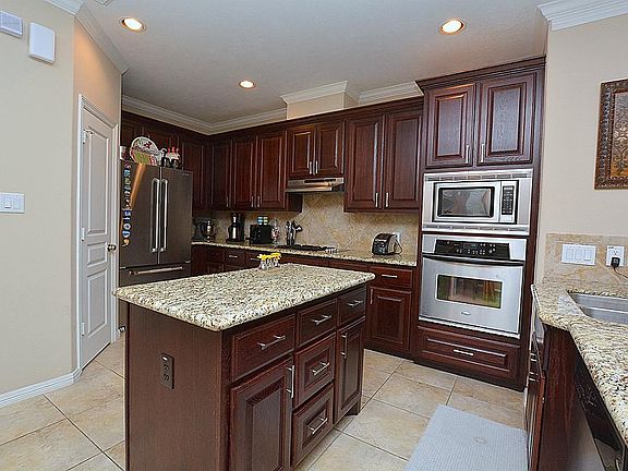 A  large walk in pantry is just though the door to the left.