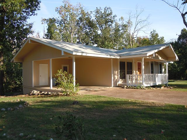 Small shop off carport