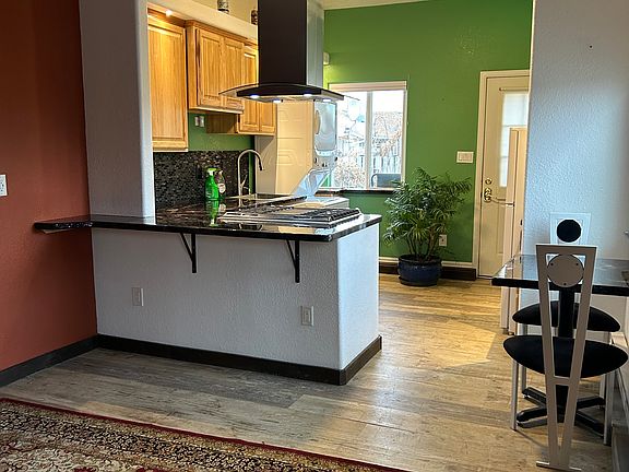 Living room connecting with kitchen area
