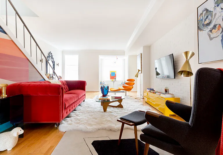 Thoughtfully designed in bold primary colors on designer Mid-Century furnishings!