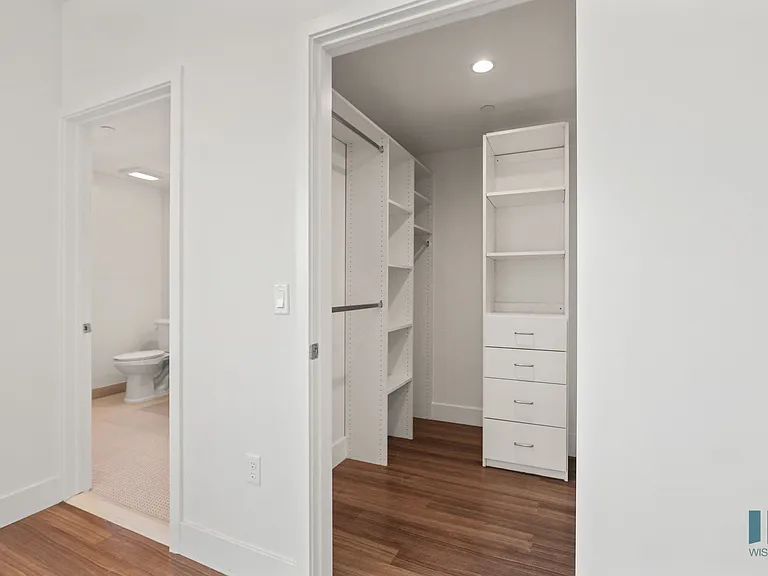 Bedroom with Walk-In Closet with Built-In Organizers