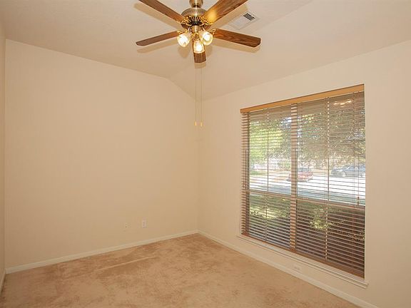 Neighborhood views stream into the flex room...