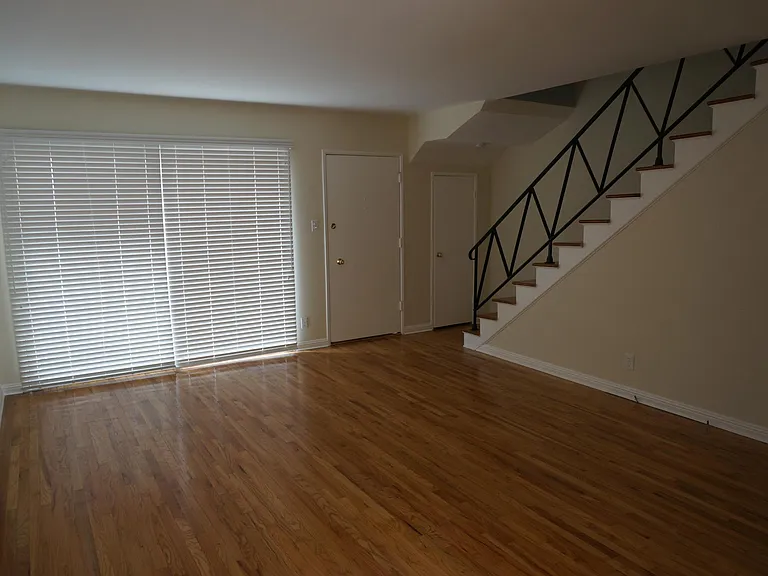 Entrance & Living room with large wall to wall windows