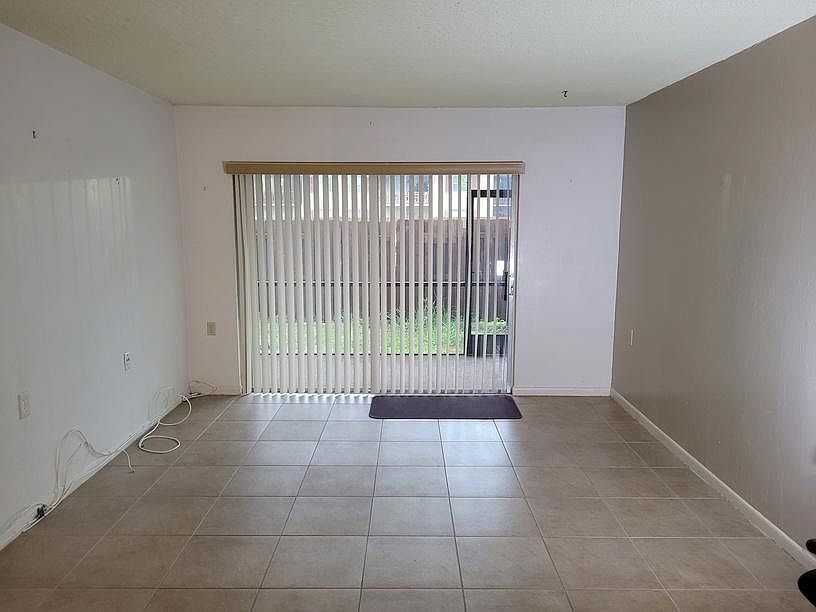 Living room looking north to screened patio