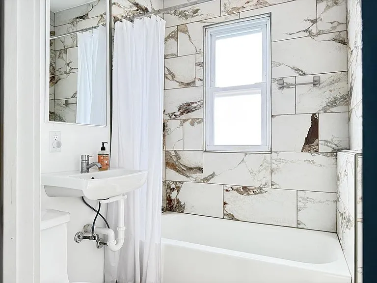 Clean Pedestal Sink and Bright Natural Light