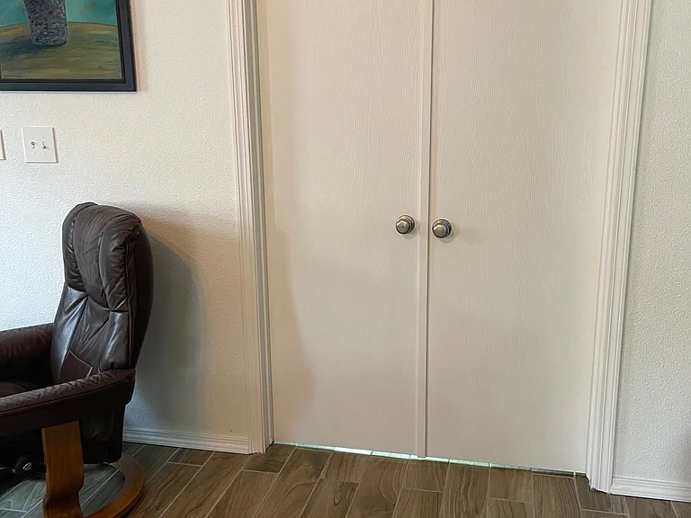 Living room with office doors closed