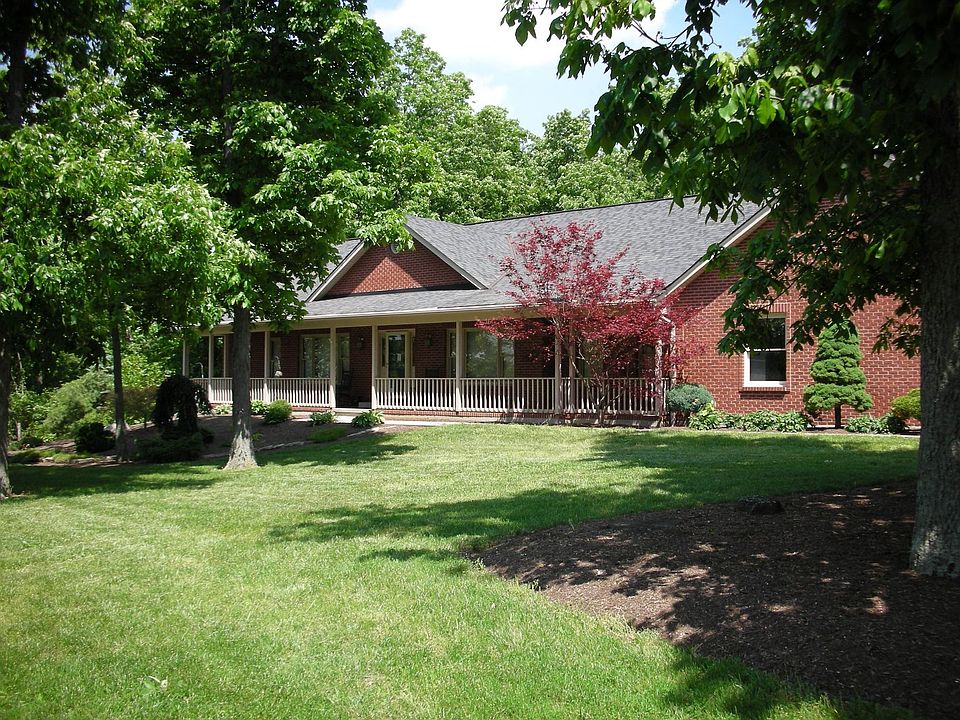 6.5 acre full brick ranch w/fin walkout LL.
