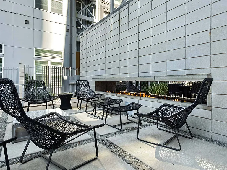 Gather around the double-sided fireplace in the courtyard, creating a cozy atmosphere for unforgettable evenings outdoors.