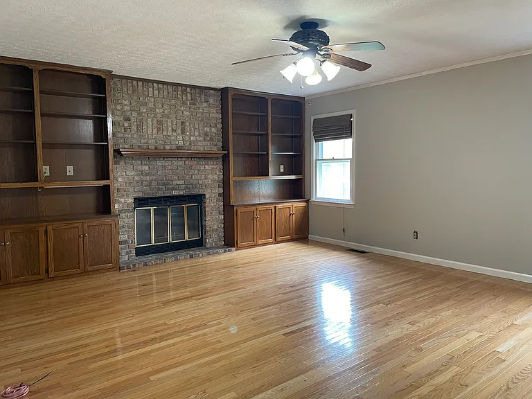 Natural gas fireplace and built-in bookshelves & cabinets