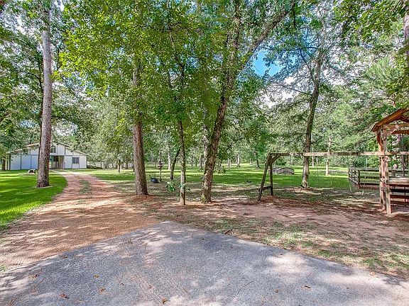 Get away from the city to this peaceful, wooded property where the deer roam. There is an open arena which is great for showing horses, stallion pasture and two other separate pastures for the horses.