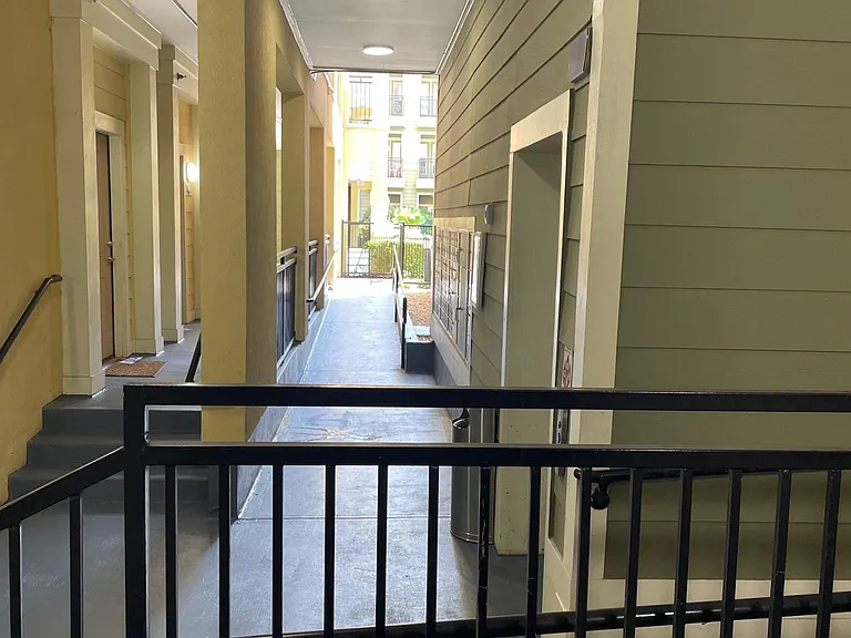 Mailboxes and hall to pool, entry to unit has option of ramp or stairs