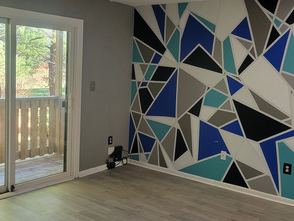 Living room with sliders to deck & utility room