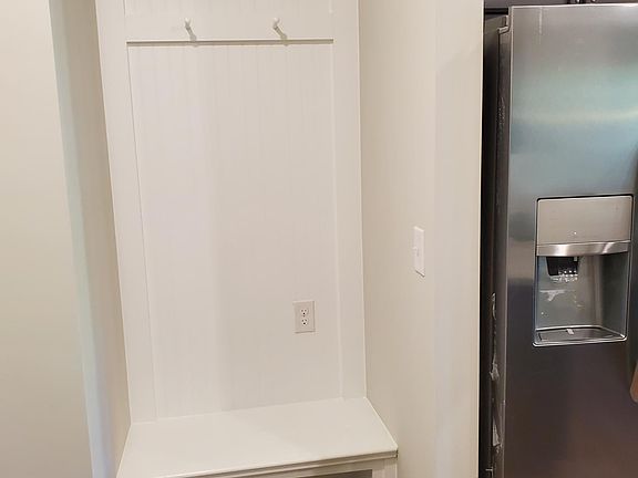 Mud area with shoe shelf and hangers