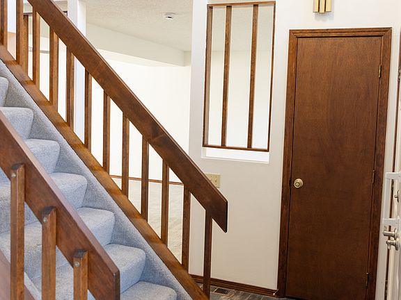 Entry - stairs have new carpet and lead to the upper level.