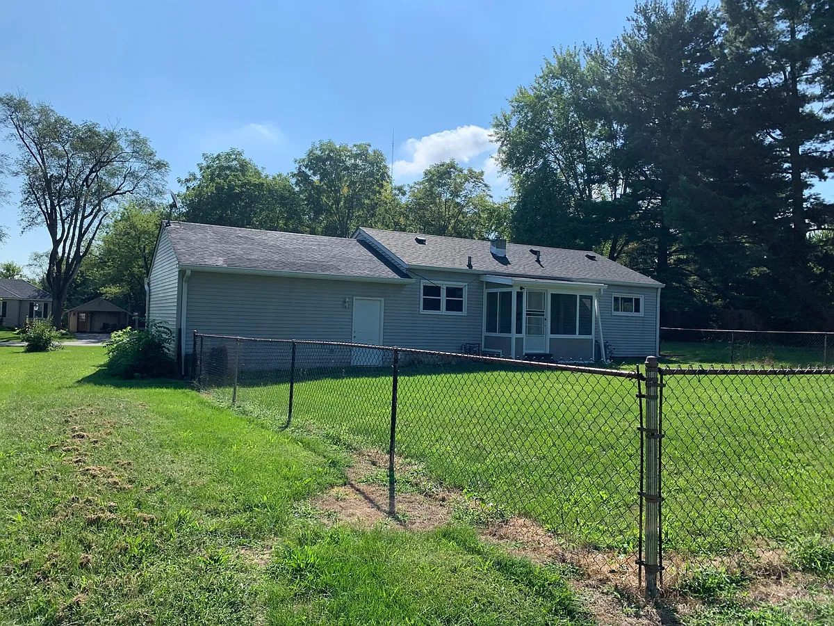 Low maintenance backyard is fenced in, so your kids can play safely while you sit on the enclosed back porch and relax - 420 S Gibson Ave