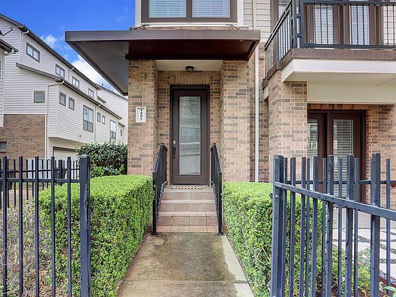 The front walk-way has a pedestrian gate.