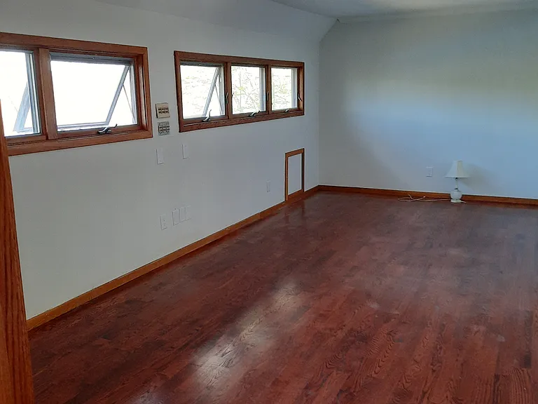 looking into the living room from door
windows provide a waterview