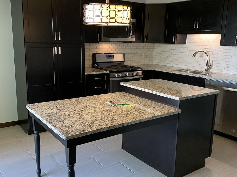 gourmet kitchen with all brand new top of the line appliances and tons of storage including a pantry and island with more storage